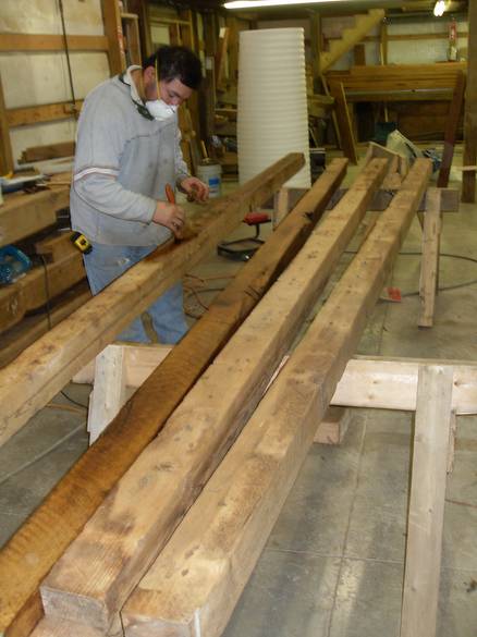 Camp Barn Restoration / Cannon Salvage workers cleaning, applying borate, and waxing the frame.